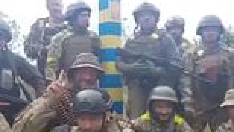 Footage shows Ukrainian soldiers making their way and then posing on the Russian border