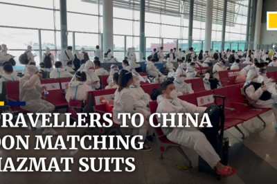 Hazmat suits and face shields worn by nearly every traveller flying to China