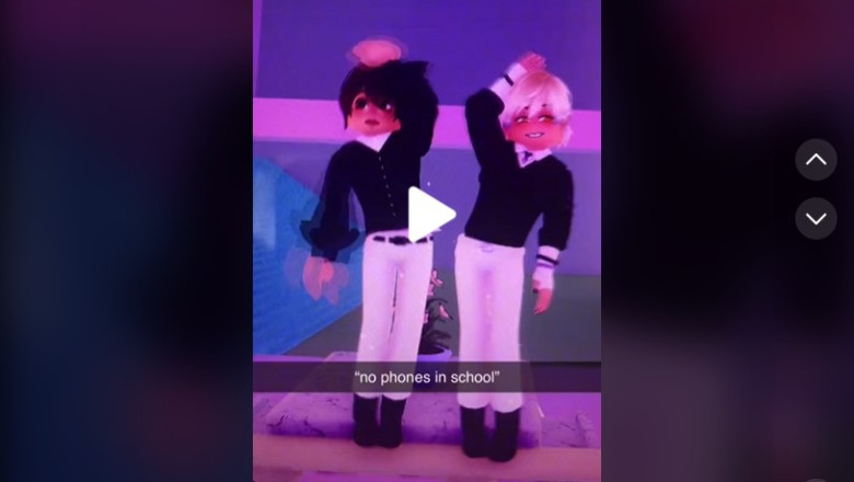 two baby dolls dancing in school