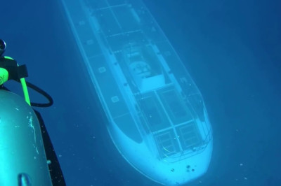 Moment Submarine goes under diver