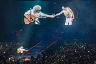 Brian May Cries while shaking hands with Imaginary Freddie in concert