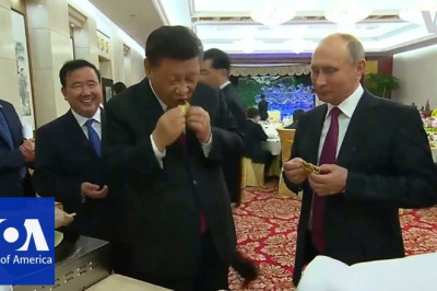 Russia's Putin and China's Xi Jinping learn to make Chinese dumplings