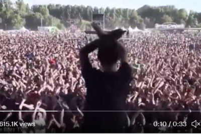 Band’s lighting techniques signals to his colleague as he tests the stage set-up and the crowd copies him.