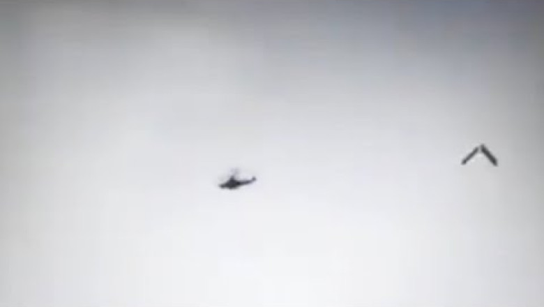 a Russian Ka-52 being shot down by a Ukrainian anti-aircraft missile ...