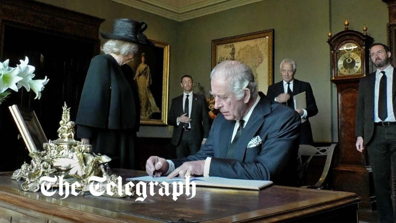 King Charles III signs Hillsborough Castle visitors book with leaking pen during Belfast trip