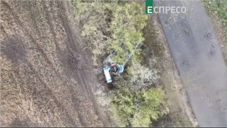 The UAV drops a grenade on the Katsap BMP-2M, which is equipped with the "Berezhok" weapons complex