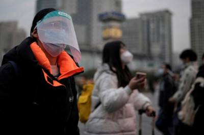 China's COVID spike not due to lifting of restrictions, WHO director says