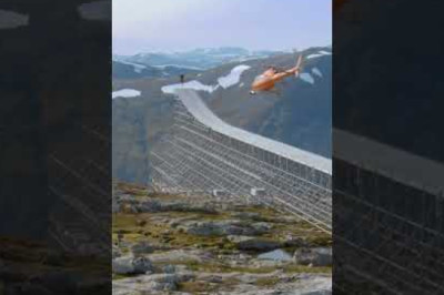 Tom Cruise jumps off a cliff while driving a motocross bike
