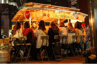 A Japanese food stall with a proprietress that is very popular among female customers.