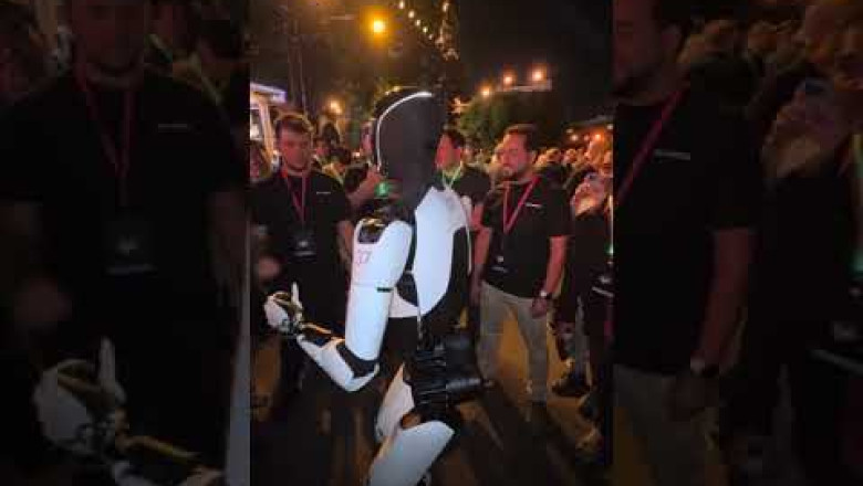Tesla Optimus Bot interacting with a crowd